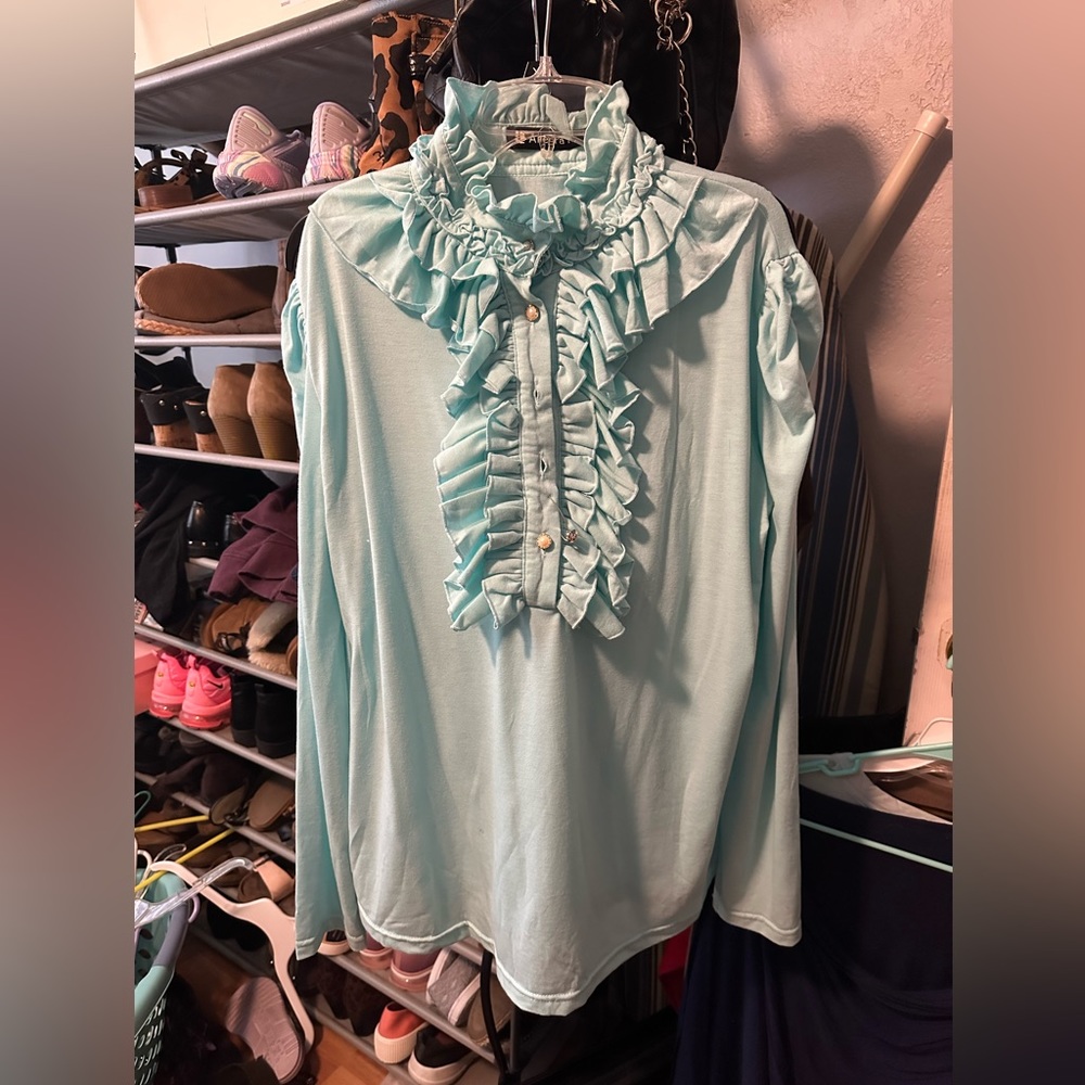 Light teal ruffle blouse